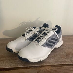 Adidas women’s navy and white golf shoes with spikes